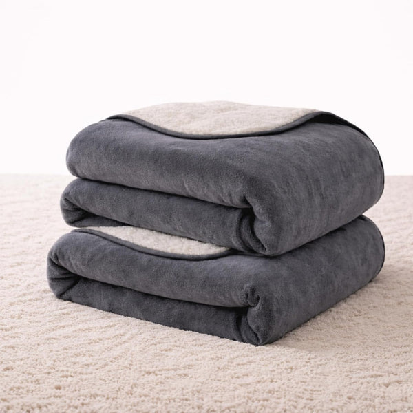Waterproof play blanket on a bed