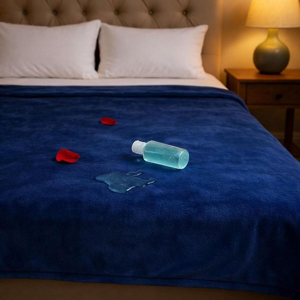 Waterproof play blanket on a bed