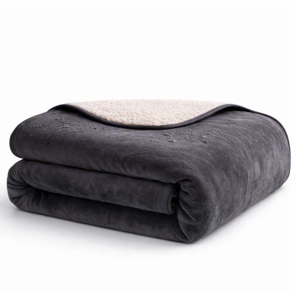 Waterproof play blanket on a bed