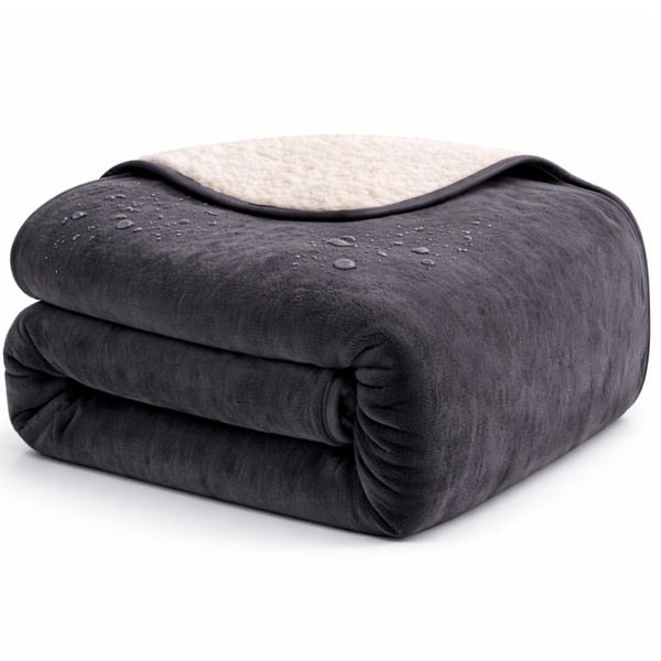 Waterproof play blanket on a bed