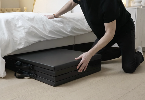 Folded table sliding under a bed