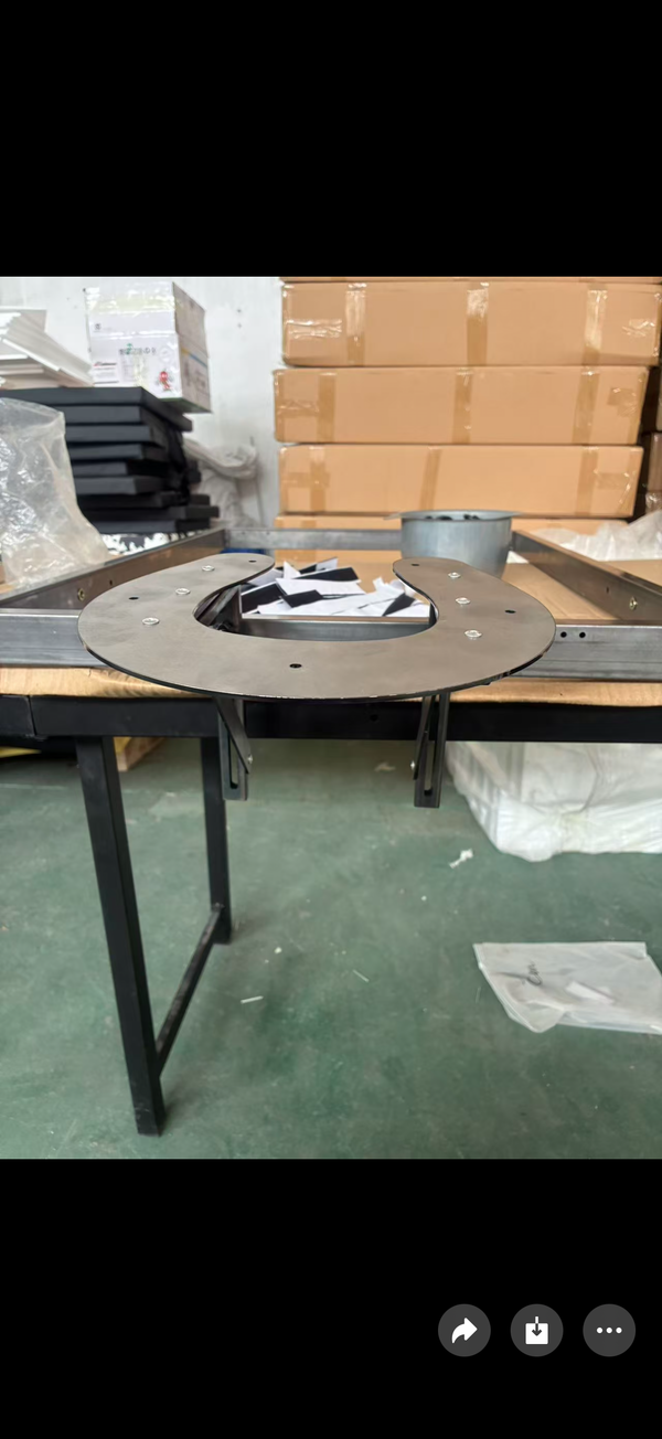 Table with leg stirrups being assembled