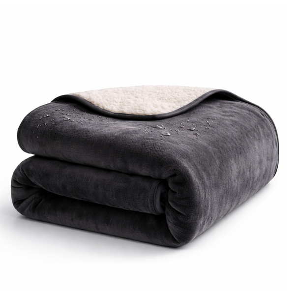 Waterproof play blanket on a bed