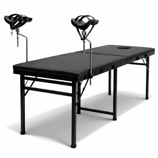 Sex table with leg stirrups assembled showing full setup with medical grade stirrups